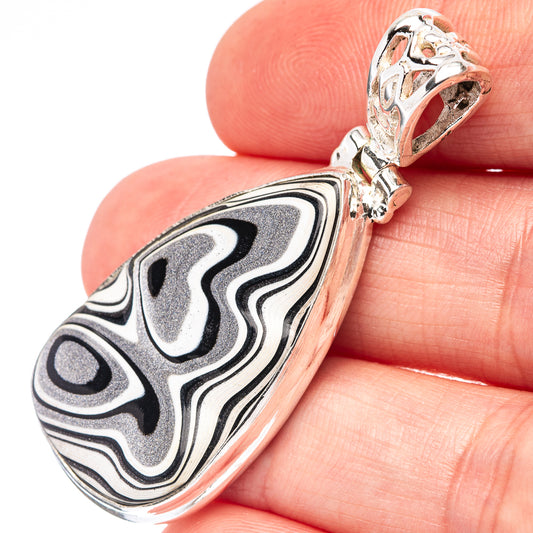 Sterling silver teardrop pendant with swirled black, gray, and white inlay, bail visible