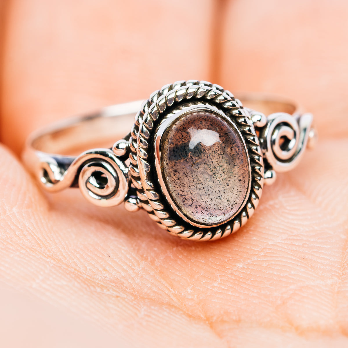 Dainty oval labradorite sterling silver ring with rope bezel and spiral scroll settings