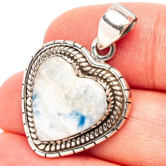 Heart-shaped sterling silver pendant with blue stone center, textured rope border