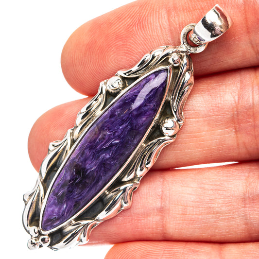 Charoite pendant in .925 sterling silver with elongated oval purple stone bezel