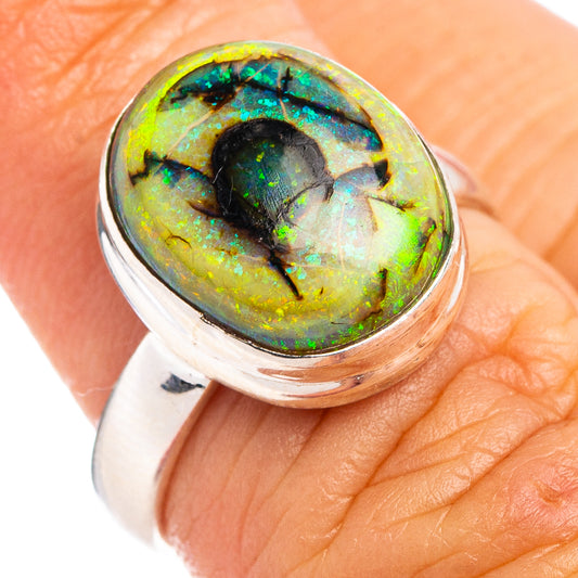 Sterling silver opal ring with oval black-and-green iridescent stone, size 6