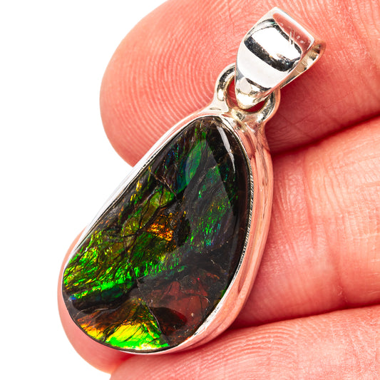 Ammolite pendant in teardrop setting with iridescent green, black, and silver frame