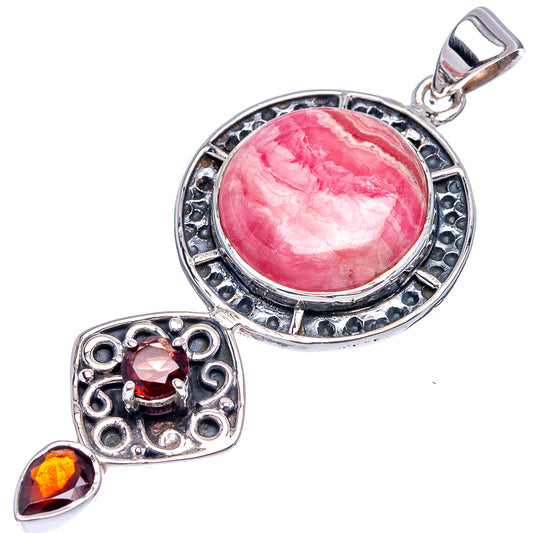 Round pink rhodochrosite pendant in ornate .925 sterling with garnet side stones