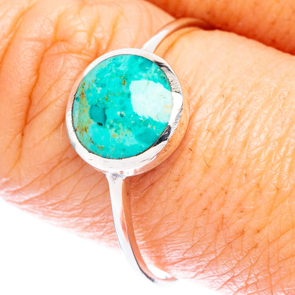 Sterling silver ring with oval turquoise cabochon in round bezel