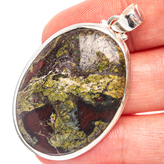 Dragon's Blood stone pendant in oval .925 sterling silver with multicolor marbled face