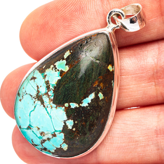 Sterling silver teardrop turquoise pendant with vibrant blue stone in open bezel