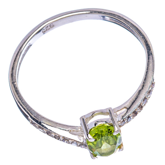 Sterling silver ring with green oval peridot and clear cubic zirconia side accents