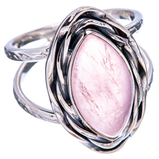 Rose quartz gemstone ring with oval pink stone and ornate twisted silver bezel
