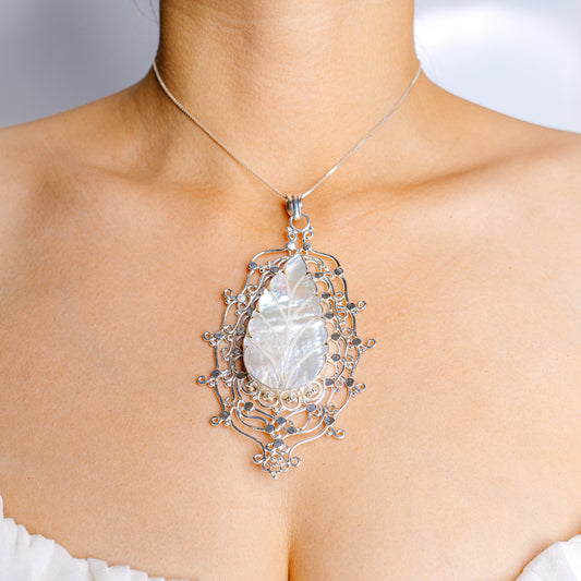 Sterling silver filigree mother-of-pearl teardrop pendant with bail on chain