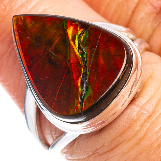 Silver ammolite ring with triangular red iridescent gemstone and green streak in bezel