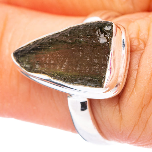Sterling silver ring with dark green teardrop moldavite stone in open bezel