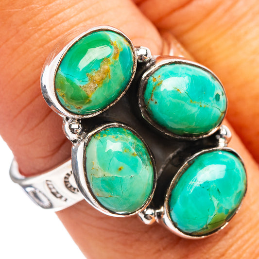 Adjustable sterling silver ring with four turquoise cabochon stones on prong settings