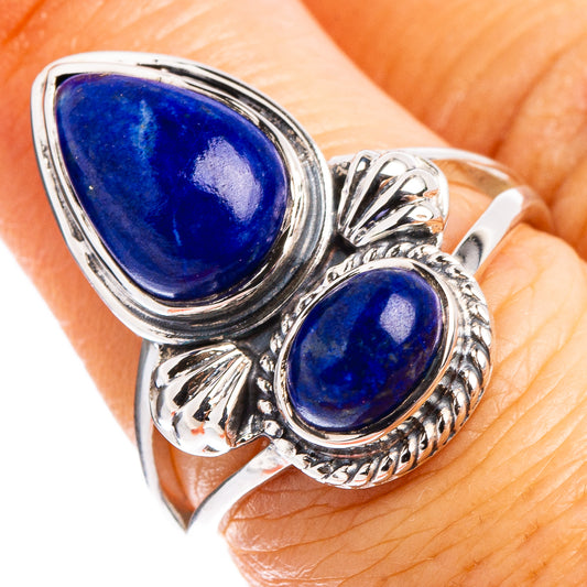 Sterling silver ring with two teardrop lapis stones, ornate raised settings