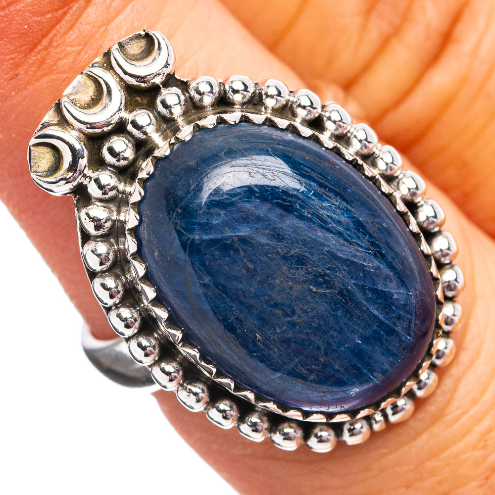 Oval blue kyanite set in sterling silver ring with beaded bezel and scalloped border
