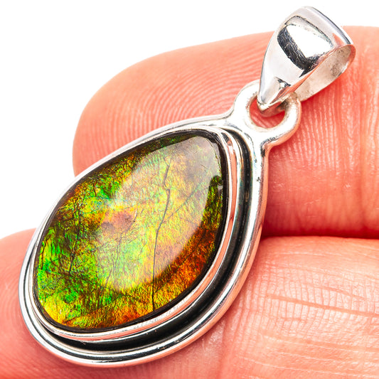 Oval .925 sterling silver ammolite pendant with iridescent green-orange shimmer