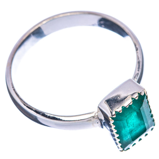 Sterling silver ring with dark green faceted emerald cushion and side prongs
