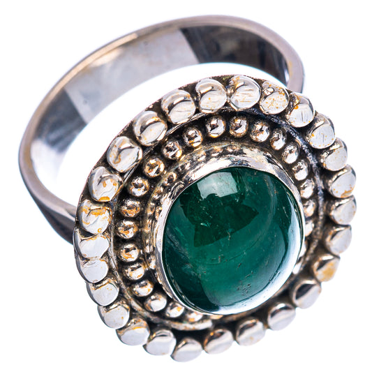 Adjustable sterling silver ring with green oval cabochon and raised beaded edge