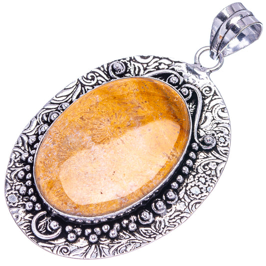 German silver coral pendant with orange oval stone bezel and decorative edge