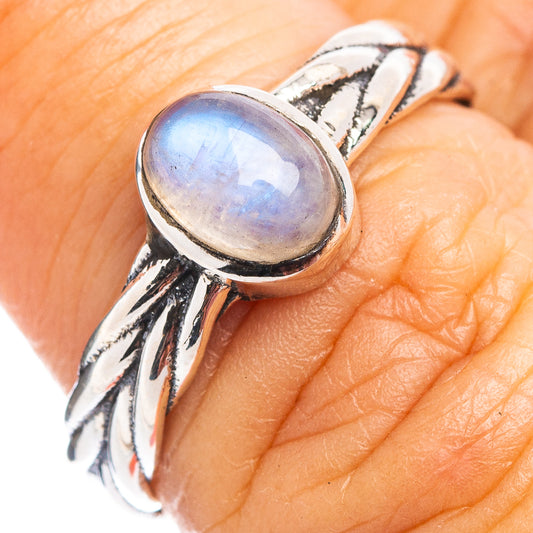 Rainbow moonstone dainty ring with oval iridescent stone and twisted .925 silver band