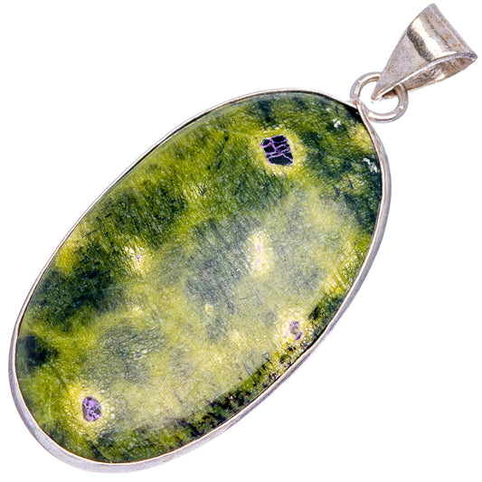 Silver-plated stichtite teardrop pendant, green cabochon with purple inclusions.