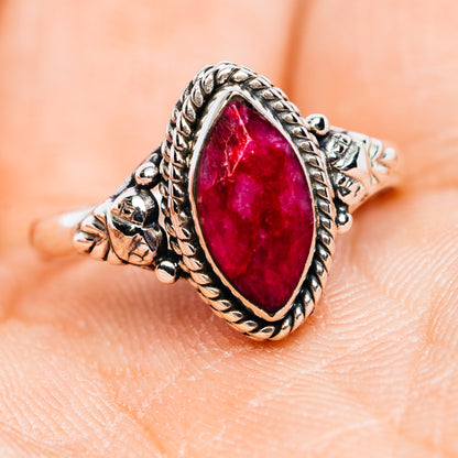 Sterling silver ruby oval ring with ornate rope-edge halo and side detailing