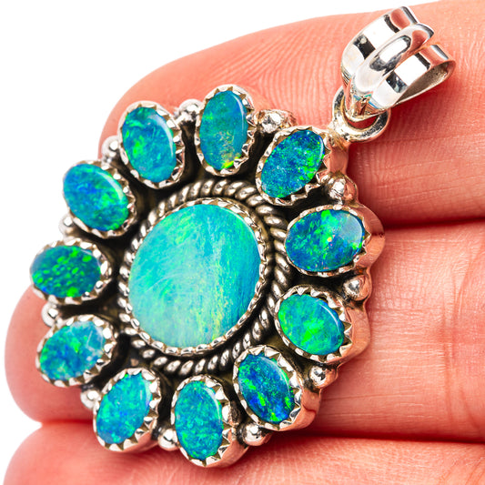 Sterling silver opal pendant with bezel-set oval blue-green doublet stones, cluster design