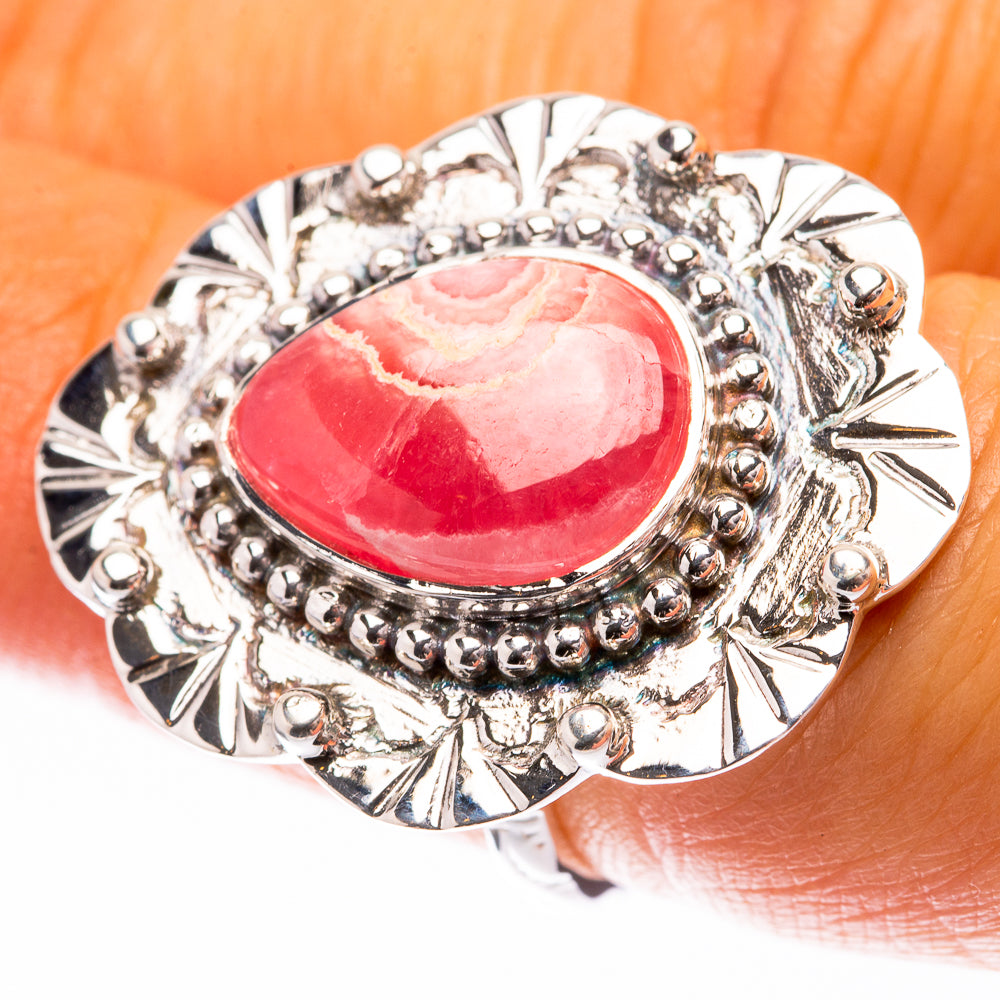 Sterling silver rhodochrosite ring with oval pink cabochon and bead halo