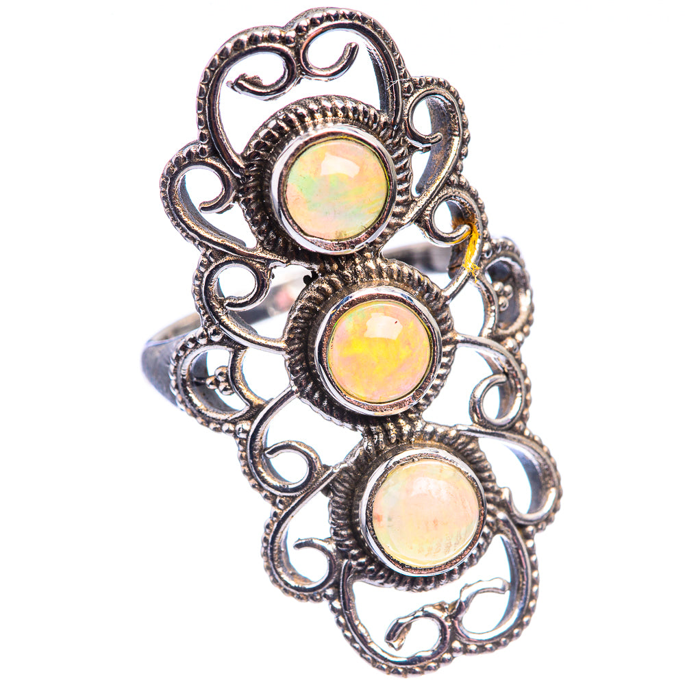 Sterling silver opal ring featuring three oval cabochon stones in heart-style filigree