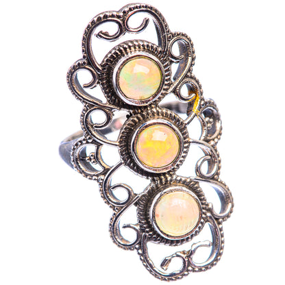 Sterling silver opal ring featuring three oval cabochon stones in heart-style filigree