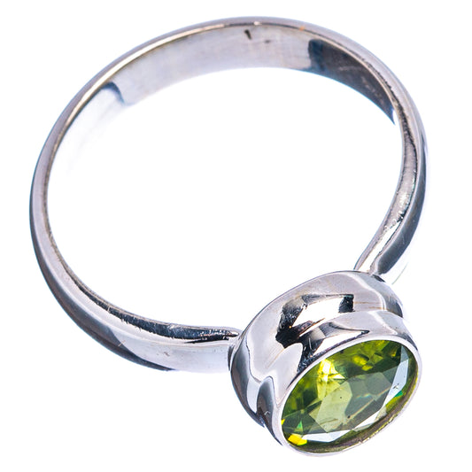 Faceted peridot ring in .925 sterling silver, round green gemstone and polished band