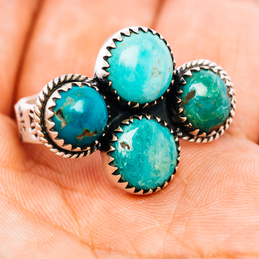 Turquoise ring with four oval cabochons and serrated .925 sterling silver bezels
