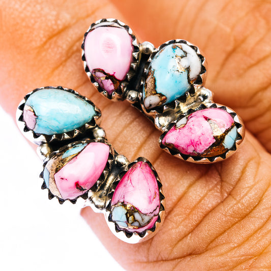 Southwestern style cocktail ring with five oval pink, turquoise, and white stones in silver