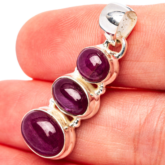 Three-stone oval ruby pendant in .925 sterling silver bezel setting