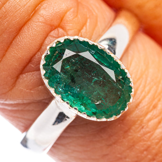 Oval faceted green emerald ring in .925 sterling silver, bezel setting
