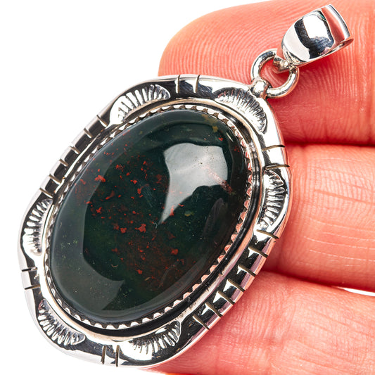 Oval bloodstone pendant with dark green gemstone in .925 sterling silver frame