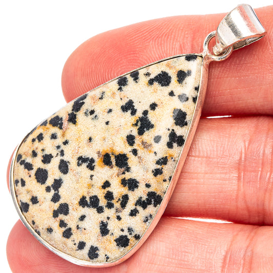 Dalmatian jasper teardrop pendant with silver-plated bail, speckled stone