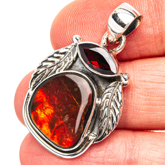 Sterling silver ammolite pendant with oval red-orange gemstone and leaf filigree