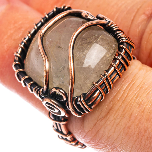 Oxidized copper wire-wrap ring with clear gray quartz center stone.