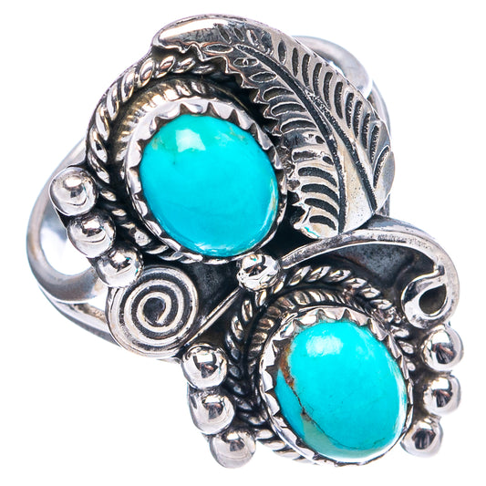 Turquoise oval cabochon ring in .925 silver with engraved leaf band and side details.