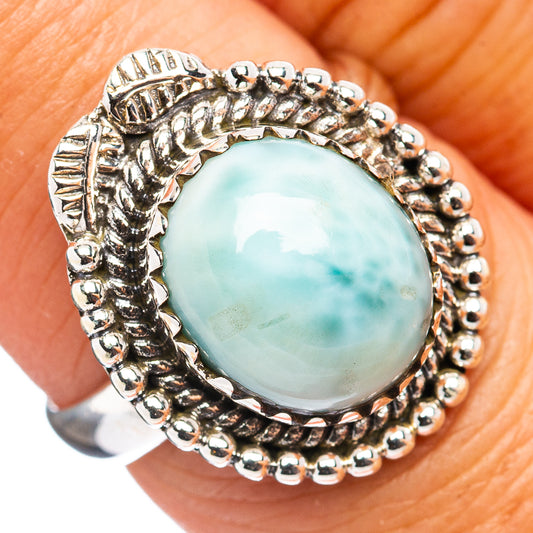 Sterling silver ring with oval light blue Larimar stone and bead rope setting
