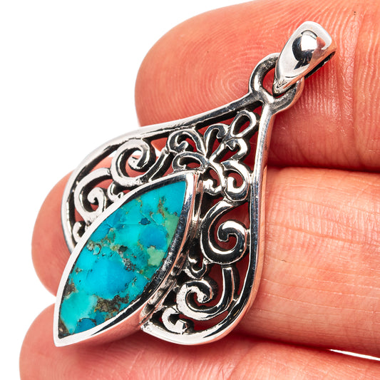 Turquoise teardrop pendant in sterling silver with ornate filigree and bail loop