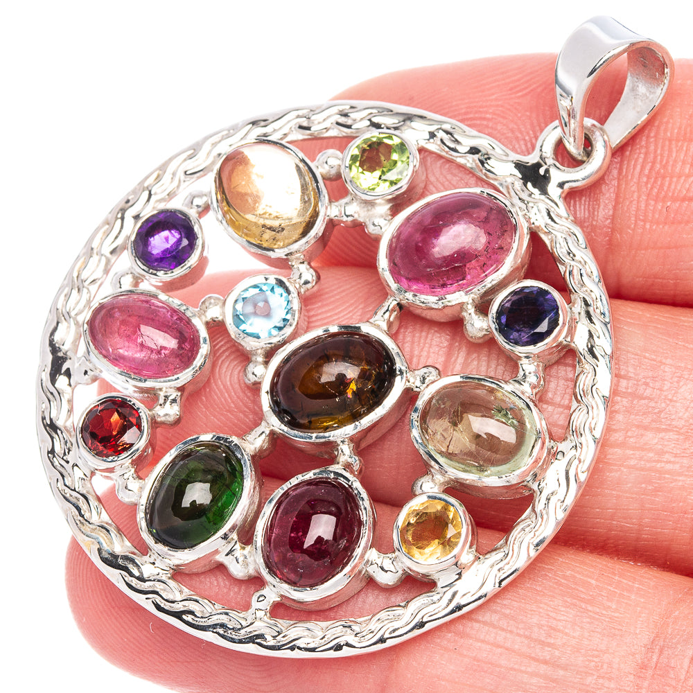 Round sterling silver pendant featuring multicolor gemstones in bezel settings, top bail