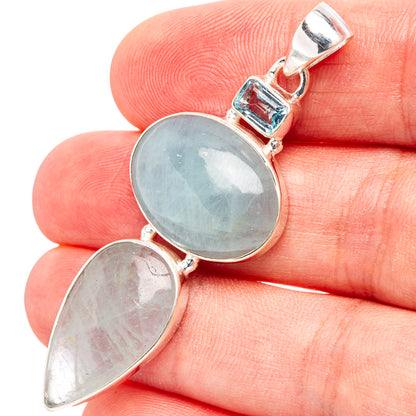 Sterling silver pendant with oval blue gemstone and smaller pear-cut blue stone