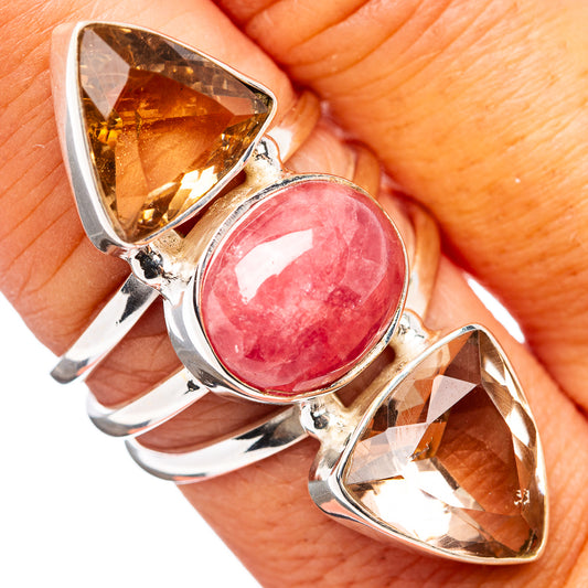 Sterling silver ring with oval pink rhodochrosite center and two brown faceted stones