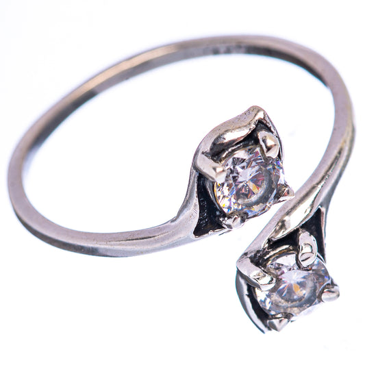 Sterling silver cubic zirconia ring with round center stone and side stones, size 7