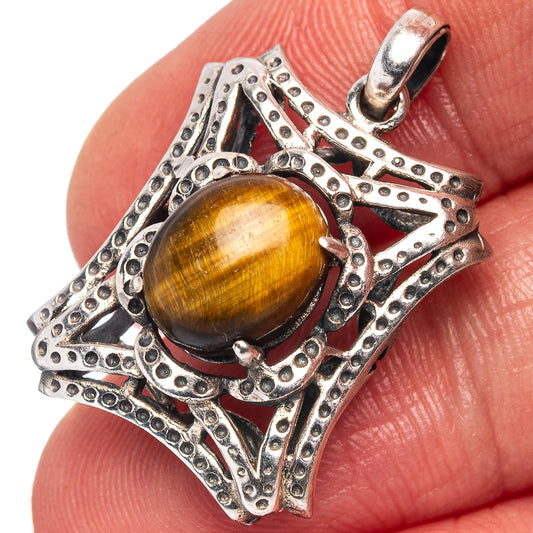 Tiger's eye pendant with round cabochon in ornate .925 sterling silver frame