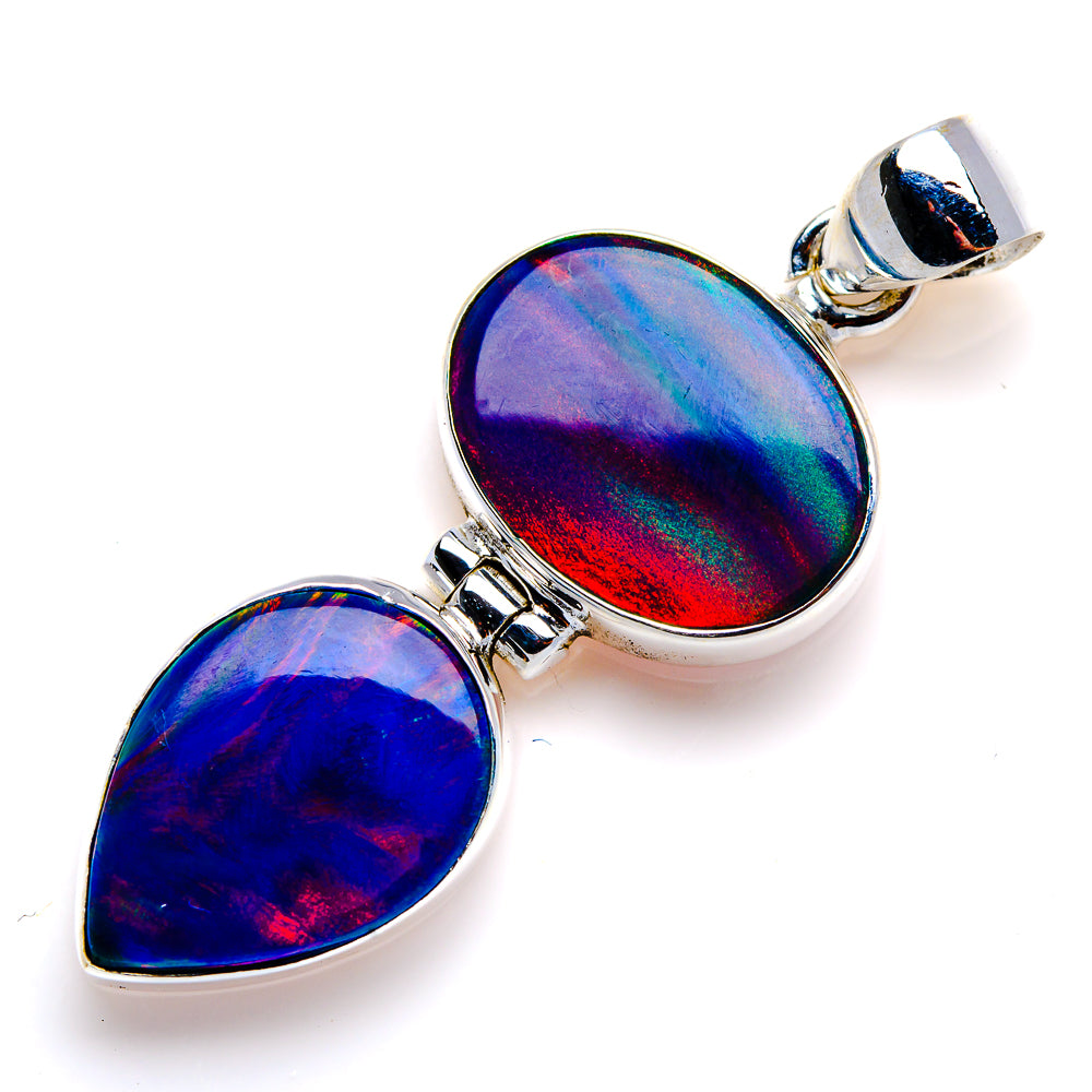 Sterling silver opal pendant with two iridescent teardrop cabochons and silver bail