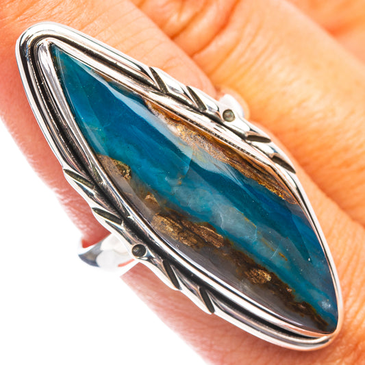 Oval blue opal ring with polished .925 sterling silver and decorative openwork frame