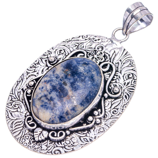 Ornate German silver pendant with oval blue sodalite cabochon and decorative raised frame