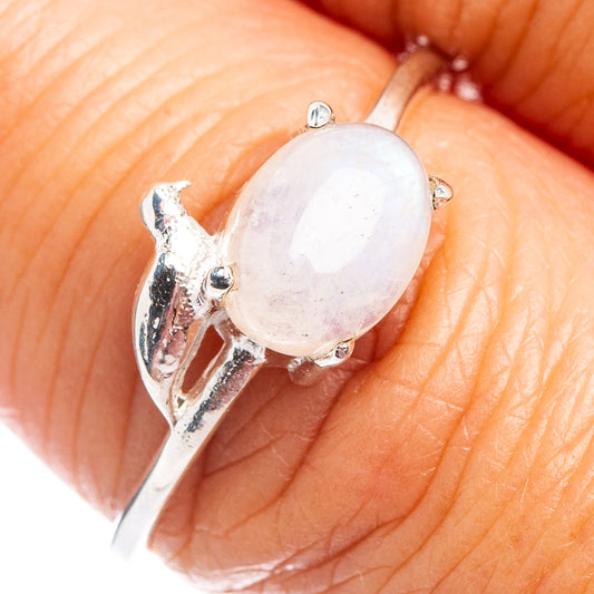 Dainty sterling silver bird ring with oval opalescent moonstone centerpiece